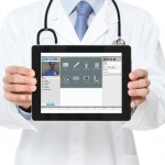 Doctor holding an ipad implementing telehealth strategies.