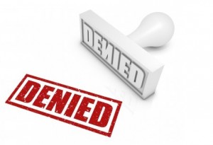 A white stamp with hte capitalized word "Denied" and a red outline wiht bolded text saying "Denied". inaccurate reporting leads to issues with communication and cost overruns. 