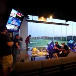 BHM Staff, and family enjoying time together at Top Golf.