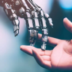 A robot hand reaching out to touch a human hand