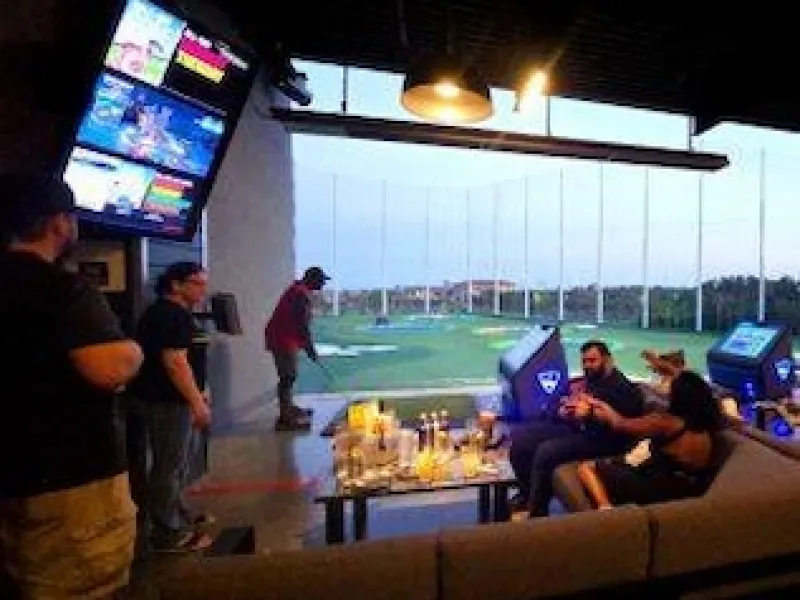 BHM Staff, and family enjoying time together at Top Golf.